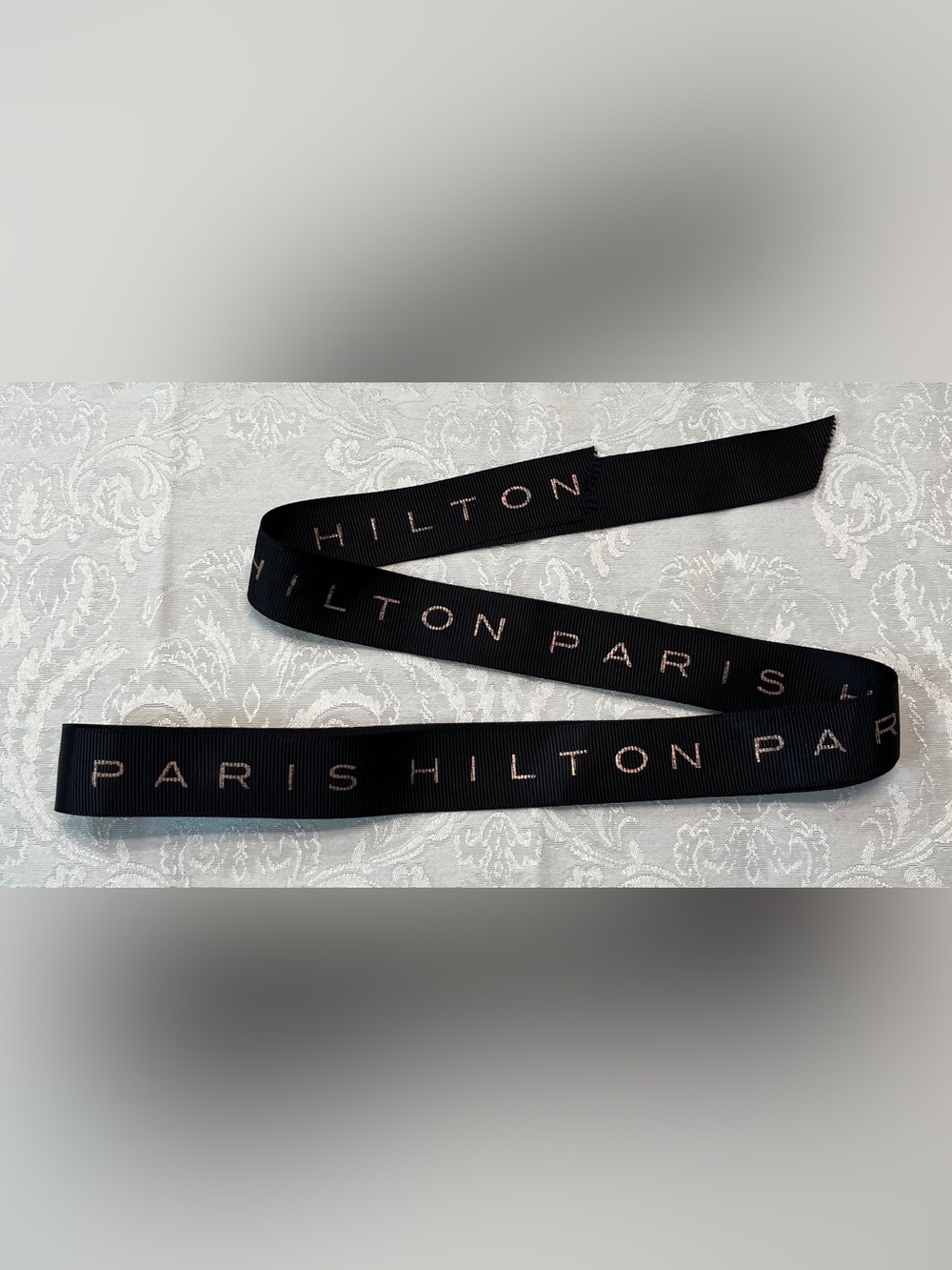Paris Hilton Black Ribbon with Metallic Pink-Gold Logo